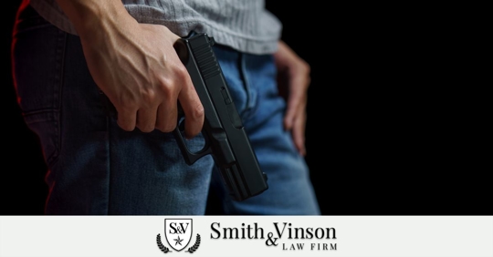 man holding a gun in his hand